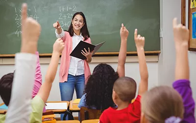 A teacher with a class of students in the classroom