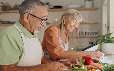 Older couple cooking