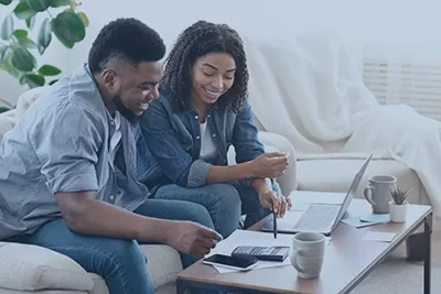 Young couple looking at a computer