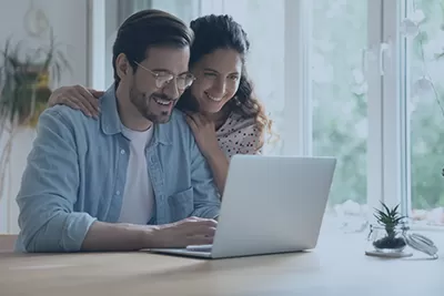 A couple looking at a computer