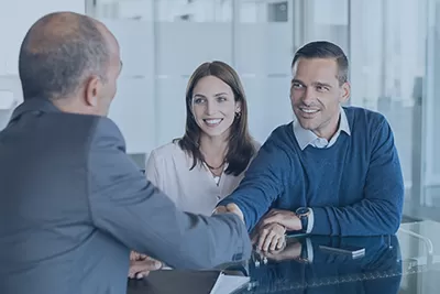 Middle age couple in a business meeting with a financial advisor